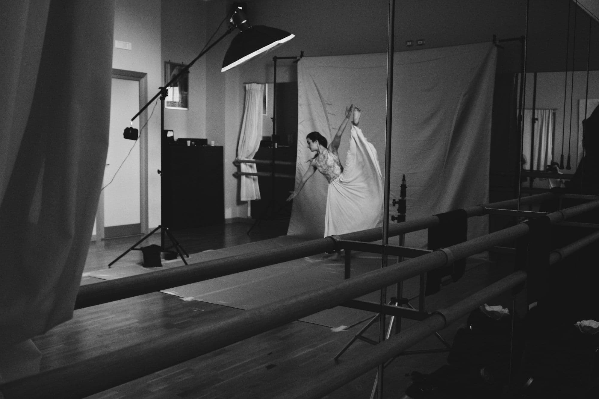 a black and white photo of a woman in a studio